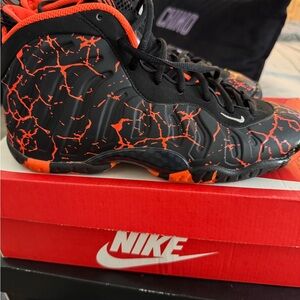 Nike Black and Orange Crackle Foamposite Sneakers
Size 7y